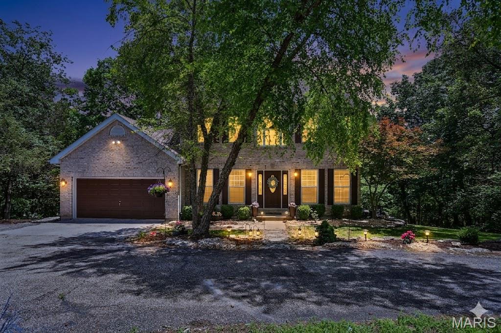 Open Sunday, 6/14, 2-4pm.   Escape to Paradise, move in ready home on private 5+ acres in Rockwood Schools!  Experience the perfect blend of privacy and luxury in this move-in-ready, beautifully maintained estate. Located in a private subdivision with paved roads, this home features an open floor plan with spectacular views, a cozy wood burning fireplace, and main-floor essentials including a formal living area or dedicated study, formal dining room, laundry and powder room. The sun bright spacious kitchen with walk out to multi level deck overlooking a wooded backyard and a sparkling swimming pool. Perfect spot for enjoying your morning coffee. Upstairs features 4 generously sized bedrooms, including a luxury primary suite with a soaking tub, separate shower and double vanities. The ultimate bonus… A fully finished walkout lower level equipped with a full bath, craft room, storage area, family room and a second kitchen/bar, leading to a pergola-covered deck with unmatched sunset views. Perfect for all your entertaining and summer pool parties.  Or, simply pour a drink and watch the sunset melt over your private oasis. Your dream home is ready for you. Contact us today for a private viewing!