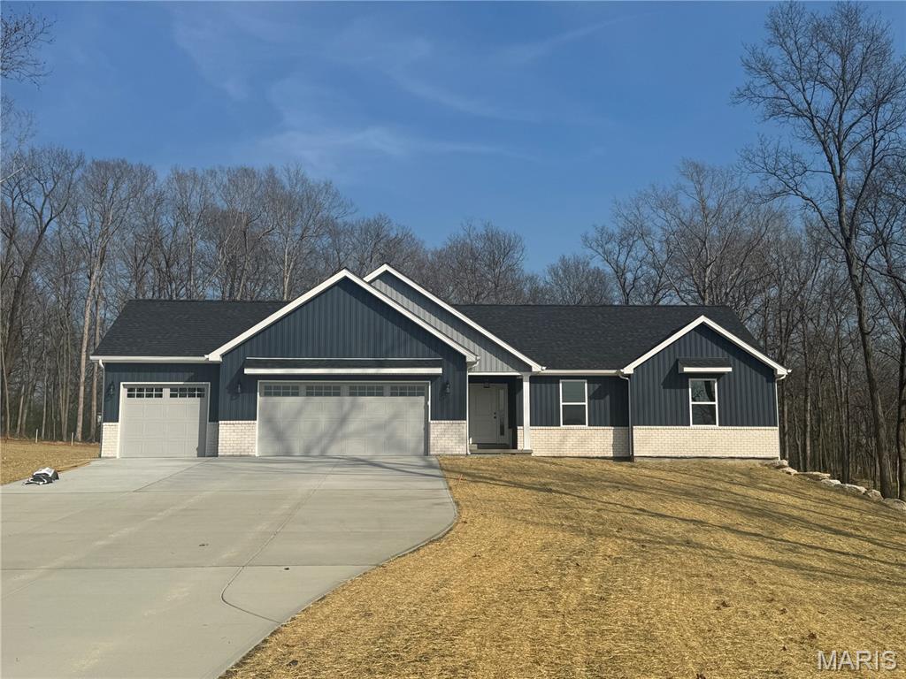 Welcome to country living within minutes of Troy and Moscow Mills in this amazing new construction opportunity to pick everything out. This is a TBB home but will get started this summer so if it is not started you can pick everything and add upgrades if desired. The Silverton model ranch home features 1576 sq ft 3 bedroom, 2 bath and oversized 3 car garage. This home will come upgraded cabinets including a center island, granite countertops, vaulted ceiling in great room/kitchen, hardwood style laminate flooring in main living area, stainless steel appliances, and too many more upgrades to list. The exterior of the home will features maintenance free vinyl siding, architect shingles, concrete patio, and great view from the main living area to enjoy your property. This home will be built on nice 3,42 acre wooded lined lot with plenty of flat space for that future outbuilding, pool or whatever you want since it is not in a subdivision. All finished home pictures are of previously built Silverton home shown with some upgrades. Act now and you can help with positioning of home on the lot. Agent owned.