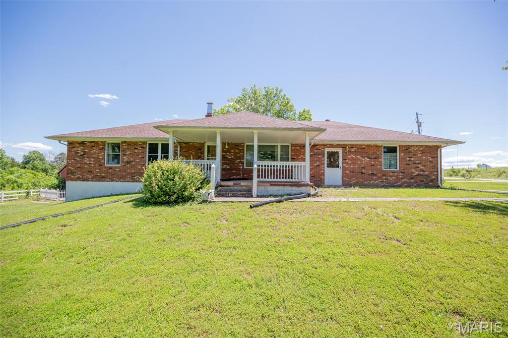 Brick home on 7.8 acres+/-   Endless potential and just minutes from St James. Located only 6 miles from town, this solid brick home offers the perfect opportunity to create your dream country property. Plenty of room for gardening, livestock, recreation, or future improvements, the possibilities are endless! 3 Bedrooms and 2 baths. Basement is finished and ready for your own touches. Lots of storage area. Separate 24x30 two car garage with concrete floors. Enclosed lean to for small equipment. Room for horses, a few cows and chickens to make your own mini farm. Wet weather creek runs along the northeast edge of this property. Come take a look at this one today!