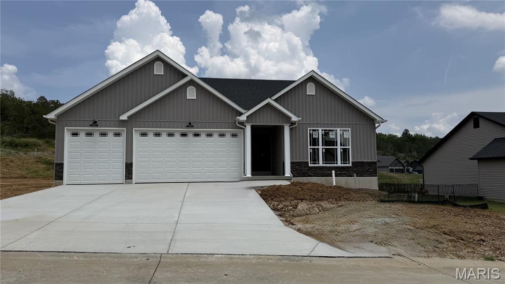 Spec Home - Under Construction - You will love this beautiful, 3 bed, 2 bath home. Tons of room in over 1600 sq. ft. home with a wonderful floor plan. 3 car garage.  Features include cathedral ceilings in great room, kitchen & breakfast room. Spindels @ stairs w/upgraded newel post.  Black faucets & trim, Vertical siding in front, Stacked stone sill high, 4 can lights in kitchen, waterline for icemaker, rough in full bath in lower level, Additional window in great room, 12x12 covered composite deck, upgraded flooring in main area, 8' tall insulated garage doors with glass and double bowl in master bath.