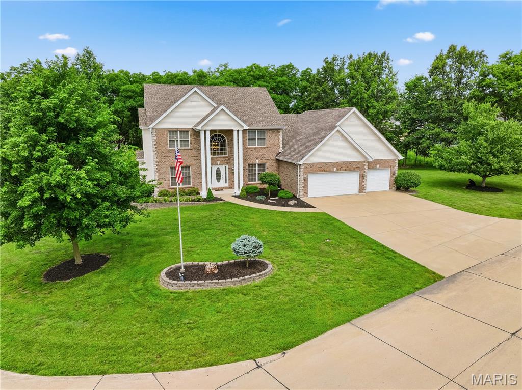 Exceptional one owner, custom home offering approximately 4,768 finished sq. ft. of thoughtfully designed living space across three levels on a picturesque 1-acre corner lot with mature trees, outstanding entertaining areas, and flexible living options. 

From the moment you enter, you’ll appreciate the impressive two-story foyer, open staircase, and dramatic two-story great room featuring a floor-to-ceiling brick vented gas fireplace. Designed for both everyday living and entertaining, the spacious kitchen includes quartz countertops, a center island with prep sink and disposal, stainless appliances including a Samsung French door refrigerator with dual ice makers and Bosch dishwasher, pantry, abundant workspace, and it opens to the inviting hearth room with cathedral ceiling, vented gas fireplace, casual dining area and Anderson French door to the new (2026) 14x20 composite deck.

The main-level primary suite creates a private retreat with vaulted ceilings, elegant architectural details, deck access through another set of Andersen French doors with built-in blinds, a large walk-in closet, and spa-like bath featuring double vanities, garden tub, and separate shower with seat.

Additional main-level spaces include a formal dining room with tray ceiling, private den/office with double French door entry and walk-in closet, dedicated laundry room, and a half bath.

Upstairs offers three generously sized bedrooms, one with a private bathroom. Each bedroom has a walk-in closet. There is an additional full bathroom, creating comfortable separation of space.

The finished walk-out lower level offers exceptional flexibility and could function beautifully for multi-generational living, extended guests, in-law quarters, private work-from-home space, or recreation. Featuring approximately 1,420 finished sq. ft., this level includes a spacious L-shaped family room, kitchenette, office or 5th bedroom with walk-in closet, full bath, dedicated hobby room, abundant natural light from eight full-size windows, French doors leading to the patio, plus extensive unfinished storage space.

Outdoor living is equally impressive with a 12 x 20 patio, mature trees, and room to enjoy the peaceful setting.

Additional highlights include hardwood flooring, porcelain tile, two vented gas fireplaces, ceiling fans throughout, zoned HVAC, newer (approx. 6-8 yrs. old) main-floor air conditioner, humidifiers on furnaces, security system, water softener, oversized 3-car garage with storage area and floored attic space, permanent vinyl siding with brick front, and new architectural shingled roof (2026).

A rare opportunity to own a spacious, well-appointed home with timeless design, modern updates, and versatile living options. 

Conveniently located with easy access to state highways while still enjoying the space and setting of approximately one acre. For added peace of mind, the seller is offering a 1-year VIP Home Warranty. Don’t miss your opportunity to tour this exceptional property. Showings start Friday — Open House this Sunday from 12:00–2:00 PM!