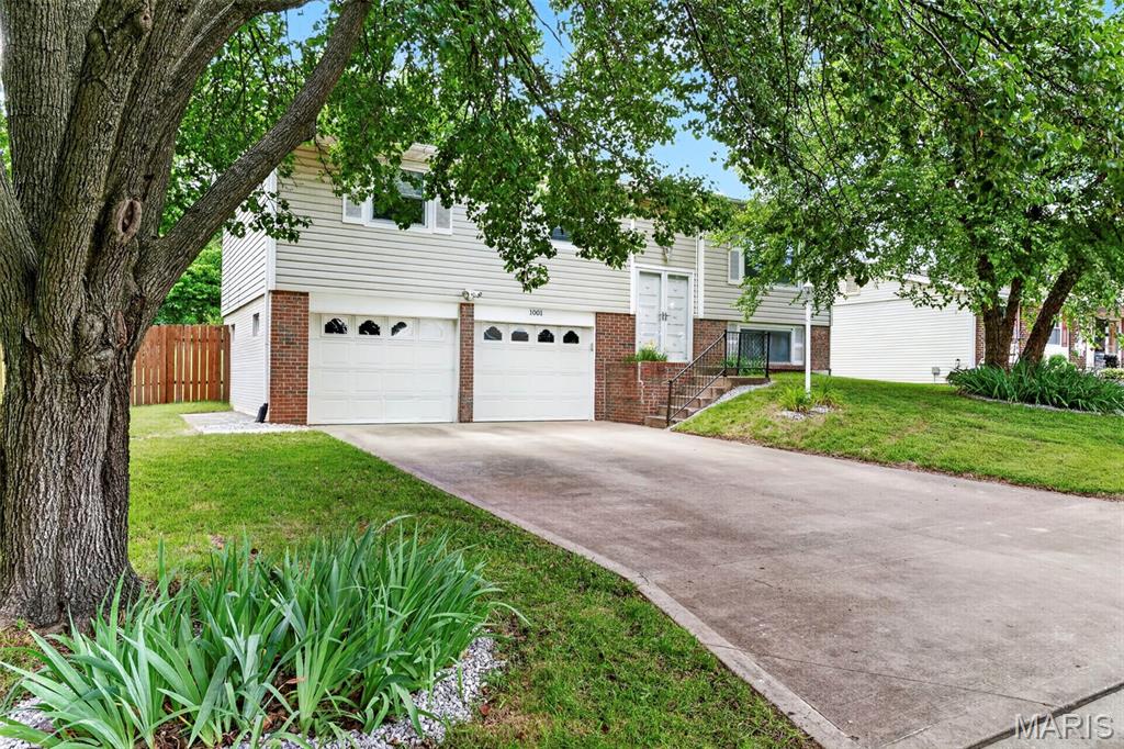 Welcome to 1001 Drexel Drive, located in Arlington Heights Subdivision. The House has an Open Floor Plan allowing lots of space to entertain and visit with family and guests. The House features a split entry with access to the Living Room, Kitchen, Bedrooms or down to the lower level Family Room, Laundry, Garage access  There are 3 Bedrooms and 2 Full Bathrooms (Primary Bath Shower only) on the Main Floor. The Living Room/Dining Room feature Luxury Vinyl Plank Flooring with a Sliding Glass Door from the Dining Room out to the covered deck area (under the covered deck is an enclosed storage area). The Eat in Kitchen features Cabinets Space, a Skylight, Pantry, Gas Stove/Oven combo a Microwave, Dishwasher, and the Refrigerator stays. The Lower Level Family Room is versatile and waiting for whatever you can imagine, also featuring  an Egress Window and wood burning Fireplace. The Washer and Dryer stay with the house. The Oversized Garage features lots of space for storage, or a workshop, hobby, craft area. The two separate garage doors both have openers with remotes (one remote for each door). Lots of space on the concrete driveway for parking as well. The yard features room for outside entertaining, yard games, gardening or just sit back and relax. The Backyard is fenced with a combination, partially wood, back fence is wire, and partially chain link. The gate to the backyard allows access to larger items. The House sits at the end of the street, so no thru traffic. Conveniently located with access to Highways, Shopping, Restaurants, Parks and Playgrounds. You are close to many new and exciting adventures. Schedule your showing today.