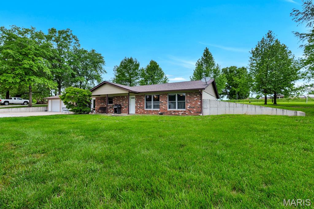 You will definitely want to see this one!  Newly updated earth contact home on over 9 acres.  Very easy access with road frontage on Hwy 47.  2 stall horse barn with fenced pasture and turn-out pen, all set up and ready for you to use.  Attached oversized garage to store all of your toys.  
Call today to set up your own tour of this perfect slice of country living!