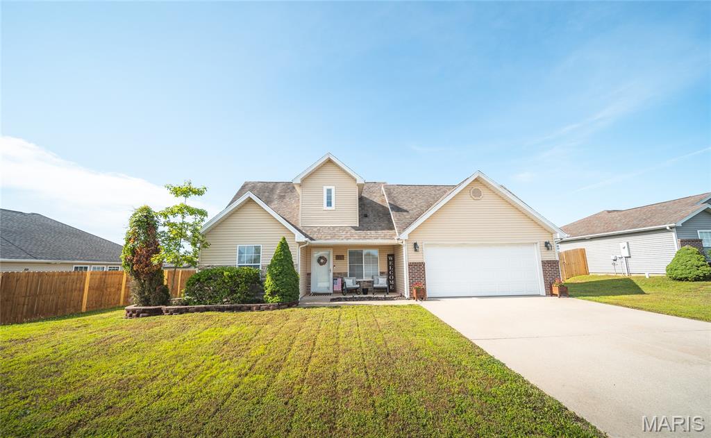 Located in the desirable Waynesville area and just minutes from Fort Leonard Wood, this beautifully maintained 3-bedroom, 2-bath home offers the perfect blend of comfort, convenience, and timeless appeal. Whether you're relocating to the area, looking for more space, or searching for a move-in ready home, this property is sure to impress.

From the moment you arrive, the inviting covered front porch welcomes you home and provides the perfect place to enjoy your morning coffee or unwind after a long day. Inside, you'll find a thoughtfully designed layout featuring luxury vinyl plank flooring throughout the main living areas, creating a warm and modern feel that is both stylish and durable.

The main-level primary suite offers convenience and privacy, making everyday living effortless. Upstairs, two additional bedrooms and a full bathroom provide comfortable accommodations for family members, guests, or a home office setup. The home's well-maintained condition is evident throughout, offering peace of mind and a true move-in ready experience.

Step outside and enjoy the level backyard, an ideal space for outdoor entertaining, gardening, pets, or simply relaxing and enjoying the fresh air. With plenty of room to create your own outdoor oasis, the possibilities are endless.

Conveniently located near shopping, dining, schools, and Fort Leonard Wood, this home offers everything you've been looking for. Schedule your private showing today and discover why this charming Waynesville home deserves a place at the top of your list!