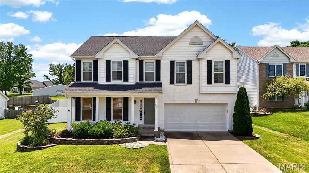 Welcome home to the heart of Wentzville! This spacious and well maintained 4-bedroom, 2.5-bath beauty has room for everyone—and then some! Come and see the primary bedroom!!! 

From the moment you step inside, you'll love the bright open floor plan, gorgeous luxury vinyl plank flooring, granite countertops, and custom built-in shelving surrounding the cozy wood-burning fireplace.

The kitchen flows into the oversized living and dining areas, making it perfect for entertaining family and friends. A coffee/drink station is a nice add on with extra counterspace. A large main-floor laundry room with cabinets adds everyday convenience, while the partially finished basement offers even more living space complete with an electric fireplace—ideal for movie nights, a game room, or your favorite hobby. Need extra storage space- Look behind the sliding barn doors. There is plenty more to add your finishing touches with additional living space and still have so much room for storage.

Step outside to your own private backyard retreat featuring a tall privacy fence, a beautiful pergola, and a separate deck that's ready for summer BBQs, morning coffee, or relaxing evenings under the stars.  Plenty of room for the kids/pets to run and play or host family and friends gatherings.

The showstopper? A MASSIVE 400-square-foot primary suite that feels like your own private getaway! Enjoy plenty of room for additional sitting areas, plus a luxurious en-suite bath with dual sinks, a soaking tub, and a separate shower.

Fall of 2023 Updates~ NEW ROOF, gutters, siding, garage door with opener, glass slider door, ducts cleaned. NEW HVAC 2025.
Located just minutes from parks, the Wentzville Recreation Plex, shopping, restaurants, and with easy access to major highways, this home offers the perfect combination of space, style, and convenience.

This isn't just a house—it's the place you'll love coming home to!  Ready to move in!