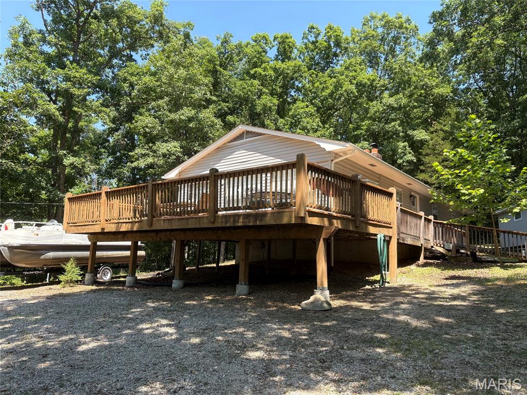 The best of both worlds!! This property offers nearly all the perks of lakefront living without the lakefront price. Fantastic property sitting directly across the street from the beach.  Just steps from your driveway is a gentle walk to the water. But that is just the beginning of what this home has to offer.  This updated  3/2 ranch features open floor plan, fireplace, large utility room, and massive master bedroom suite featuring cultured marble corner tub and separate large shower with seat.  Additional features include deck big enough for all your friends and family, storage shed with electric and oversized wooded lot.  Did I mention this home comes mostly furnished.  You’ll be able to start enjoying this property the day you close!