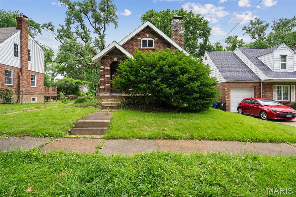 Attention Investors, Rehabbers, and Handy Owner-Occupants! Opportunity knocks with this classic brick home packed with character, square footage, and value-add potential. Featuring nearly 1,500 square feet above grade, this property offers a flexible floor plan with two main-level bedrooms, a spacious living room, a formal dining room, and an expansive upper level complete with a large loft area, an additional bedroom, and storage space.  Original hardwood floors, newer windows, arched doorways, built-in shelving, vintage millwork, and a decorative fireplace provide the architectural details buyers are searching for and create the perfect foundation for a renovation. The detached garage, level backyard, and attractive brick exterior further enhance the property's long-term potential.  Whether you're looking for your next fix-and-flip project, a rental property with room to enhance both functionality and returns, or a home where you can build equity through improvements, this property offers a rare opportunity to bring your vision to life.  Property to be sold as-is.