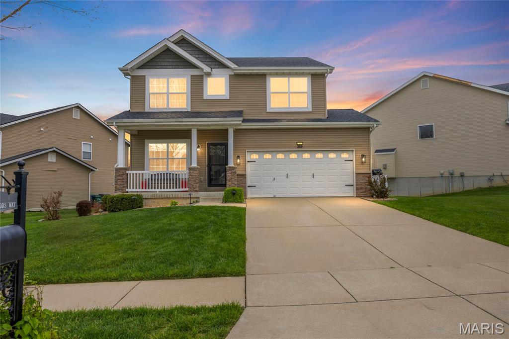 This attractive four- bedroom two story is designed for both everyday living and entertaining. A welcoming covered front porch opens to a light-filled interior highlighted by nine- foot ceilings and easy- care laminate flooring. The open-concept floor plan flows seamlessly from the living room into the spacious family room accented by a gas fireplace that creates a warm and inviting focal point.
The adjacent kitchen is impressive with its 42' mahogany cabinets, stainless steel appliances, tile backsplash, pantry and breakfast bar. Steps away is the convenient laundry room. Step outside and enjoy the large deck that overlooks a low maintenance white vinyl fenced back yard. This is a perfect spot for morning coffee and casual dining.  Step upstairs to the vaulted primary suite featuring a walk-in closet and a luxury bath. The spa-like bathroom has a double bowl vanity and a separate tub/shower, Three additional bedrooms, an open flex-space and a full bath complete this floor. The neighborhood offers two parks with playgrounds, a pavilion and a basketball court. Easy access to major highways. Located in the Fort Zumwalt North school district. Landlord prefers to rent for 24 months and prefers credit score of 700 or above with an income of three times the rent. One small or medium pet is allowed with $250 non refundable pet fee.