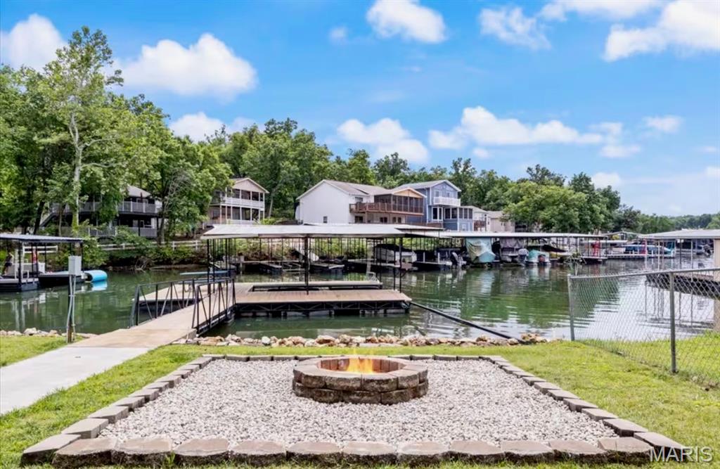 Welcome to lake life at its best in the Village of Four Seasons on the beautiful Lake of the Ozarks!
This charming 3-bedroom, 2-bath waterfront home offers 1,280 square feet of comfortable living space and the perfect blend of relaxation and recreation. Whether you’re looking for a full-time residence, weekend getaway, or investment property, this home checks all the boxes.
Step inside to find a bright and inviting interior with an open living and dining area designed to capture lake views and natural light. The efficient layout makes great use of space, offering comfortable bedrooms and two full baths for family and guests.
Outside is where this property truly shines. Enjoy direct waterfront access with your handicap-accessible dock, making lake days easy and inclusive for everyone. Fish, swim, or hop on your boat with convenience and confidence. The dock provides ideal access for all ages and mobility levels — a rare and valuable feature on the lake. The dock incudes one boat slip and an area for hanging out and swimming.
Relax on the deck with your morning coffee, entertain friends in the evenings, or simply soak in the peaceful waterfront setting. Located in a sought-after community, you’ll also enjoy amenities and the welcoming atmosphere the Village of Four Seasons is known for. There are several popular establishments just minutes away including Shady Gators, Lil Rizzos, Horny Toad Bar & Grill & JB Hook's! Property comes fully furnished and move in ready!
If you’ve been searching for an affordable waterfront opportunity with accessibility and charm, this is it. Schedule your private showing and start living the lake lifestyle today!