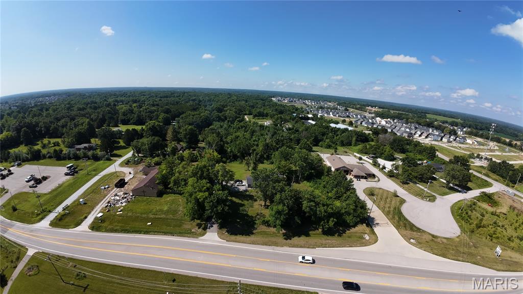 Amazing opportunity on a desirable lot on Highway N in Lake St Louis. AS IS SALE. Zoned Residential but the City Plan is to have this lot Zoned for Commercial as it neighbors the Ambulance district building, a Church and a Gymnastics center. Potential for Multi-Use commercial, a C-Store, Industrial or Neighborhood Retail Center. Commercial zoning on the south side of Highway N, a rare find, in this growing community. New developments all around.Property is being sold as-is and no showings inside the home, currently occupied, without a written offer. Public water/electric sewer available but currently on septic. 2 plots 2 tax records for a total of 3.01 acres. Tax ID's of available land: 4-0066-0061-00-0005.7000000 (2.01 acres) 4-0066-0061-00-0005.0210000 (1 acre)