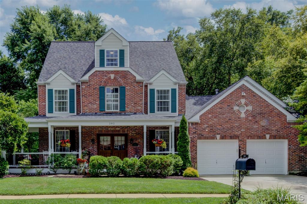 Welcome to this exceptional home in the highly sought-after Dickens Farm subdivision, a distinguished Flower Homes community known for its unique architecture, timeless elegance, and charming curb appeal. 19th century architecture meets modern living!
Lovingly built and meticulously maintained by its original owners, this 2.5-story residence has been the backdrop for decades of cherished family memories. The striking STL historic-style red brick facade—a premium builder upgrade—creates a warm and inviting first impression, drawing you toward the expansive wraparound front porch. 
Step inside to a spacious foyer flanked by formal living and dining rooms, setting the stage for both everyday living and entertaining. The heart of the home is the beautifully updated kitchen, featuring white cabinetry, updated countertops, center island, double ovens, and a cozy bay window seat overlooking the professionally landscaped backyard and peaceful wooded backdrop.
The kitchen flows seamlessly into the dramatic family room, highlighted by vaulted ceilings and a stunning floor-to-ceiling brick fireplace. A convenient laundry room, powder room, and charming screened back porch—perfect for enjoying your morning coffee—complete the main level.
Upstairs, you'll find four generously sized bedrooms, including a spacious primary suite. The recently updated en-suite bath is a true retreat, offering dual vanities, a separate shower, and a luxurious soaking tub. An updated hall bath serves the additional bedrooms.
The versatile third level offers endless possibilities, whether used as a fifth bedroom, guest suite, playroom, home office, or bonus living space. Complete with a private full bath and its own HVAC system, this level remains comfortable year-round.
The finished lower level has been freshly painted and features brand-new carpeting. A kitchen and half bath make it ideal for entertaining, holiday gatherings, or multi-generational living. The flexible layout provides abundant space to customize to your needs.
Additional highlights include an oversized two-car garage outfitted with extensive shelving and a durable epoxy-coated floor, a new roof and many upgrades throughout the home.
This lovingly cared-for home combines timeless character, thoughtful updates, and exceptional living space in one of the area's most desirable neighborhoods.