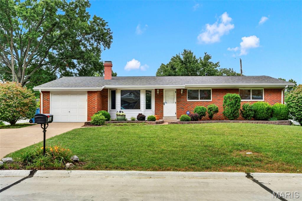 Welcome home to this beautifully maintained 3 bedroom, 2 bath ranch in the highly regarded Mehlville School District! Nestled on a quiet street with mature trees and a gorgeous lawn, this brick beauty has been lovingly cared for by one family and is ready to welcome the next.

Step inside to a bright, spacious living room with a large bay window and cozy fireplace flanked by custom built-in cabinetry creates the perfect gathering spot for movie nights and holiday mornings. The eat-in kitchen offers stainless steel appliances, ample cabinet storage, and a sunny window over the sink, flowing easily into a generous dining area with room for the whole family (and then some).

The primary bedroom offers a private en-suite bath, while two additional bedrooms share a full hall bath — all featuring gleaming hardwood floors and neutral tones ready for your personal touch. Stylish top-down/bottom-up shades throughout add both charm and function, giving you control of light and privacy in every room.

Downstairs, the finished lower level delivers incredible bonus space with a large recreation room, an additional finished room perfect for a home office, playroom, or guest space, plus a workshop/utility area for hobbies and storage leaving endless possibilities!

Outside, enjoy a covered patio overlooking the fenced backyard, ideal for summer barbecues, morning coffee, or watching the kids and pets play. A one-car garage and long driveway offer plenty of parking and storage.

Recent updates give peace of mind for years to come, including a newer roof and gutter guards so you can spend less time on maintenance and more time making memories.

This home has been cherished for years and is truly move-in ready. Don't miss your chance to make it yours schedule your showing today!