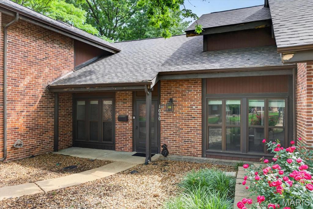 Back on the market through no fault of the seller!! Look no further! This move-in-ready, low-maintenance, resort-style condo is located in one of the area's most desirable locations! This 3 bedroom 2 bathroom home has COVERED PARKING, a NEWER ROOF/GUTTERS and is fully updated and conveniently located to highway 55/255/270. Amenities include a sparkling pool, tennis courts and beautifully maintained grounds - all just steps from your door. Ideally located near shopping, dining, parks and everyday conveniences- all while offering a peaceful residential feel. Relax on the covered front porch or entertain in the back yard with the bricked paved patio and privacy fence. Inside, on the main floor, you will find a vaulted ceiling in the living room, a bedroom, full bathroom, laundry, dining room and updated kitchen - appliances can stay! Take the stairway to the second floor to find 2 additional bedrooms, another full bathroom and lots of storage in all of the closets! Additional perks: thermal windows, recessed lighting, freshly painted, and newly cleaned! Condo fees include landscaping, sewer, water and trash.  Hurry fast and be the next person to enjoy a rare opportunity to own one of the most updated and refined condos in the community. Few units offer this level of finish, condition and amenities. This home offers the perfect blend of comfort, style, convenience and a lifestyle that is difficult to match!