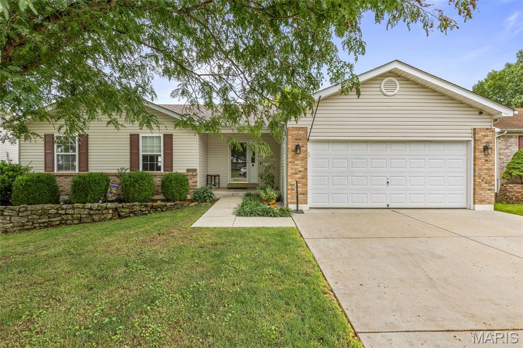 Welcome home to this beautifully maintained property in a charming, family-friendly neighborhood! From the moment you pull up, you'll notice the exceptional pride of ownership reflected in the home's inviting curb appeal and thoughtfully landscaped, low-maintenance yard.

Step inside to discover an open, light-filled living space featuring soaring ceilings and a wall of windows that flood the home with brilliant, natural light. The well-designed kitchen offers both functionality and convenience, seamlessly connecting to the dining area for easy everyday living and entertaining.

The main level features three large comfortable bedrooms, two full bathrooms, and the added convenience of a main-floor laundry. Downstairs, the finished lower level provides a spacious, versatile living area that can serve as a family room, recreation space, or even a private guest suite. A large full bathroom includes a luxurious soaking tub and separate shower, creating the perfect retreat.

The glass patio doors open to a generous backyard with a patio—ideal for relaxing, entertaining, or watching children and pets play. The yard offers just the right amount of space: large enough to enjoy without the burden of extensive maintenance.

This truly move-in-ready home offers comfort, style, and functionality in a neighborhood you'll be proud to call home. Don't miss the opportunity to make it yours!