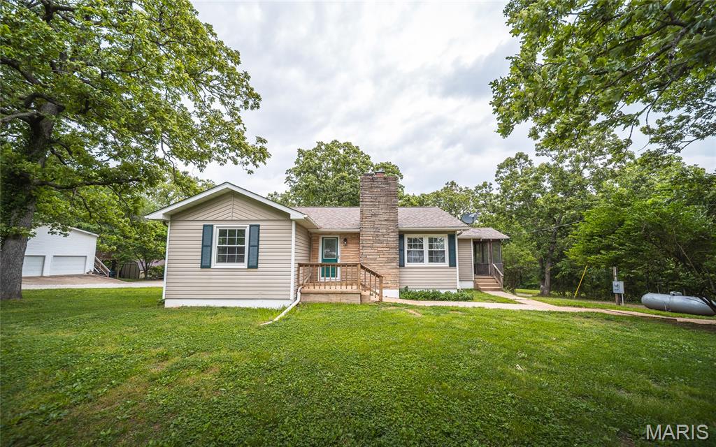 Step into comfort, style, and functionality with this beautifully updated 3-bedroom, 2-bath home that offers the perfect blend of modern upgrades and cozy charm. From the moment you walk inside, you’ll notice the fresh paint, updated flooring, and inviting atmosphere that instantly makes this house feel like home. The brand-new kitchen is a true standout, featuring stylish finishes, plenty of workspace, and a layout designed for both everyday living and entertaining. The main level offers warm and welcoming living spaces, including a stunning fireplace that creates the perfect setting for relaxing evenings or gathering with family and friends. Just off the living area, the sunroom provides a bright and peaceful retreat to enjoy your morning coffee or unwind after a long day while overlooking the backyard. Downstairs, the fully finished basement expands your living space with a spacious private master suite, an additional kitchen area that adds warmth and character. Whether you need space for guests, multi-generational living, or the ultimate private getaway, this lower level delivers endless possibilities. Outside, you’ll appreciate the surveyed property and fenced-in backyard area that’s perfect for dogs, playtime, or entertaining outdoors. Homes with this many updates and versatile living spaces don’t come around often—schedule your private showing today before this one is gone!