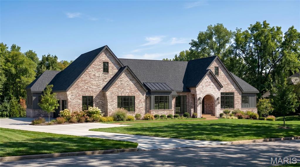 Build the Sedona and experience refined single-level luxury on a picturesque 1.3-acre homesite with this exceptional custom ranch residence offering over 5,197 square feet of thoughtfully designed finished living space. The Sedona showcases timeless transitional architecture paired with modern functionality. A welcoming foyer opens to a dramatic great room featuring soaring vaulted ceilings with decorative beam details and expansive walls of windows that fill the home with natural light while capturing views of the private homesite.

Designed for both everyday comfort and elevated entertaining, the open-concept layout centers around a gourmet chef’s kitchen with custom cabinetry, a generous center island, premium appliance options, and seamless connection to the dining area and covered outdoor living space.

The private main-level owner’s retreat offers a true spa experience with a luxurious bath, freestanding soaking tub, oversized zero-entry shower, and expansive walk-in closet. Two additional ensuite bedrooms on the main floor provide exceptional flexibility for family and guests.

The finished lower level extends the home’s livability with a spacious recreation area, walk-up wet bar, private guest suite, and full bath, with opportunities to further personalize spaces for a fitness studio, golf simulator, wine room, theater, or additional entertainment areas.
Set on a beautiful 1.3-acre homesite with room for a future pool, outdoor entertaining areas, and extensive landscaping, this is a rare opportunity to build a fully customized luxury residence tailored to your lifestyle.

The Sedona can be personalized with a variety of architectural details, finishes, and design selections. Floor plans, luxury features, and available customization options are available upon request. Renderings and photography may depict optional features, upgrades, and selections not included in the base offering.