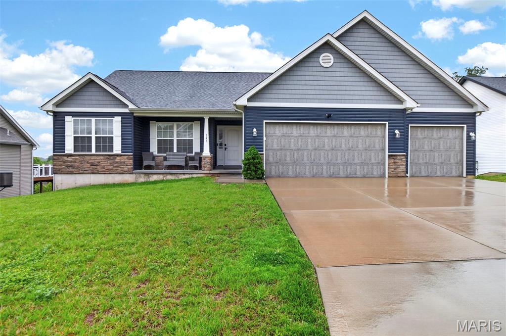 Don’t miss this stunning 4-bedroom, 2-bath home offering the perfect blend of comfort and style. Sunlit rooms, vaulted ceilings and an open floor plan create an inviting atmosphere throughout the main living space. The great room is anchored by a beautiful stone fireplace and sliding glass doors that open to a fenced backyard—ideal for indoor-outdoor living. The eat-in kitchen features a clean, modern look with 42" white Shaker cabinets, black granite countertops, stainless steel appliances, and a breakfast bar—perfect for casual dining or entertaining. Luxury vinyl plank flooring flows seamlessly through the living, dining, and kitchen areas, enhancing the home’s natural cohesion. Retreat to the spacious primary suite complete with a large walk-in closet and a luxurious en-suite bath featuring a double vanity, whirlpool tub, and separate shower. 3 additional bedrooms on the main level offer plenty of space for family or guests. The walk-out basement is waiting for you to create additional living space to fit your family's needs and opens to a covered patio overlooking the backyard—great for relaxing or entertaining. Host summer BBQs on the expansive deck, and enjoy extra storage in the backyard shed. A 3-car garage with carriage-style doors, openers, and a keypad entry adds convenience and curb appeal. Schedule your showing today!