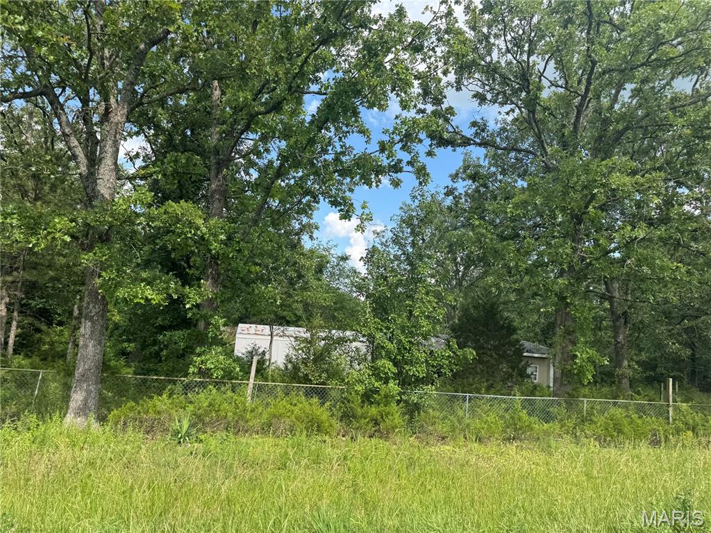 Rarely does a property with this much potential hit the market! Sitting on 4.63 acres, this unique property already has the big-ticket items in place with water, electric, and sewer available. Whether you're looking for a future homesite, investment opportunity, or your next project, the possibilities are endless.