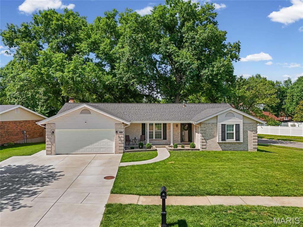 As if the street name doesn’t speak for itself, this stunning corner lot ranch is truly one of the queen bees of Bee Tree Estates! From the moment you pull into the driveway, you’ll notice the meticulous curb appeal, spacious front porch, and pride of ownership throughout. Step inside to an open floor plan featuring vaulted ceilings, abundant natural light, 3 bedrooms, and 2 full baths, including a private ensuite in the primary bedroom. The kitchen is truly the heart of the home with white perimeter cabinetry, a large butcher block island, electric cooktop, and built-in microwave. The adjoining dining area features a gorgeous gas fireplace with an eye catching mantle, creating the perfect gathering space. Just off the kitchen and dining room, you’ll find an additional sunroom that is perfect for relaxing year-round. Step outside and fall in love with the spacious backyard featuring added concrete space, a pergola, and privacy that sets this lot apart from the rest. Need even more room? The unfinished basement is ready for your finishing touches and offers endless potential to expand your living space right here in desirable Oakville. Schedule your private tour today!