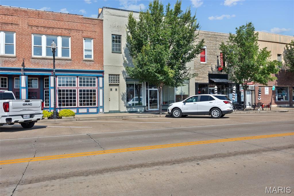 Over 5,000 sq ft of mixed use commercial and apartment space located right on Main Street in the heart of De Soto! This unique property offers endless potential for investors, business owners, or owner occupants looking to create additional income streams.

The main level offers flexible space that could easily be converted into a large office, retail storefront, or even an additional apartment while still maintaining a small office area in the front. The property also features a garage/storage area in the rear, adding even more functionality and value.

Upstairs features an apartment that needs a little TLC, but with some updates could become a great source of additional rental income.

Excellent visibility, strong Main Street presence, and tons of upside potential make this a rare opportunity in a growing area. Bring your ideas and make this property your next investment!