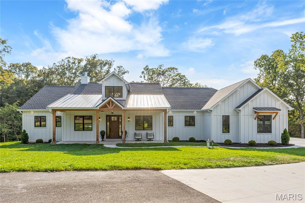 New construction in the newly developed Woods of Sandy Creek. This spectacular transitional home features light-filled rooms with oak hardwoods, 10’ ceilings & expansive windows that offer continuous vista views throughout the home’s interior. Wide covered porch entrance leads to impressive 2-sty foyer, private study, formal dining room and stunning great room highlighted by brick fireplace. Culinary enthusiasts will love the state-of-the-art kitchen with quartz countertops, custom white cabinetry, Cafe appliances, 12’ center island & butler’s pantry. Vaulted primary bedroom suite with luxury bath with freestanding tub provides an appealing retreat. 3 Additional bedrooms, 1 with ensuite bath & 2 with Jack n’ Jill bath, complete the main floor living quarters. Lower Level entertainment space includes recreation room, office & full bath. Situated on a wooded 5-acre double lot adjacent to Sandy Creek with composite deck, covered patio & oversized 3-car garage.