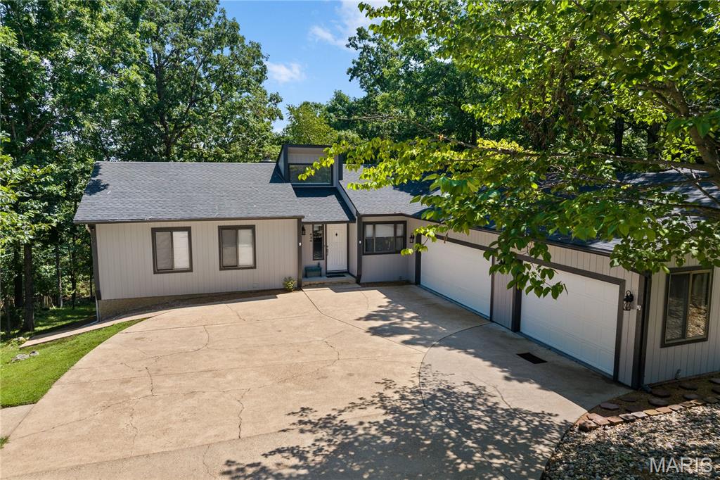 Village of Four Seasons Ranch! Motivated Sellers, Bring Any Reasonable Offer! This Ranch style walk-out home spans 5+ beds & 3 baths, offering a rare layout designed for large families, multi-generational living, & dual-family ownership. The interior has new tile entry, carpet, LED fixtures, ceiling fans, doors. The kitchen consists of quartz countertops, tile backsplash, & new appliances. Primary suite w/ private bath & new quartz vanity. Convenience is key with dedicated main-level laundry. Versatile Lower Level & ADU Potential as the walk-out lower level serves as true 2nd living quarters, w/ wood-plank laminate flooring, living room w/ gas fireplace, full kitchen, 2 BR, bonus room, & a 2nd laundry. Key features: 3-car heated garage + parking for 9; Safe room (plumbed); 9 total appliances: 2 Refrigerators, 2 Dishwashers, 2 Stoves, 1 Washer, 1 Dryer; 1 Microwave; Water Softener-Owned; new water heater; 2-year-old roof, gutters, & fresh paint/trim. Close to amenities including, campground, skate park, swimming pool, tennis courts, playground, boat ramps, fishing lakes & even a new aquatic center for year-round swimming, walking path. Don't miss this one-of-a-kind, turn-key gem!