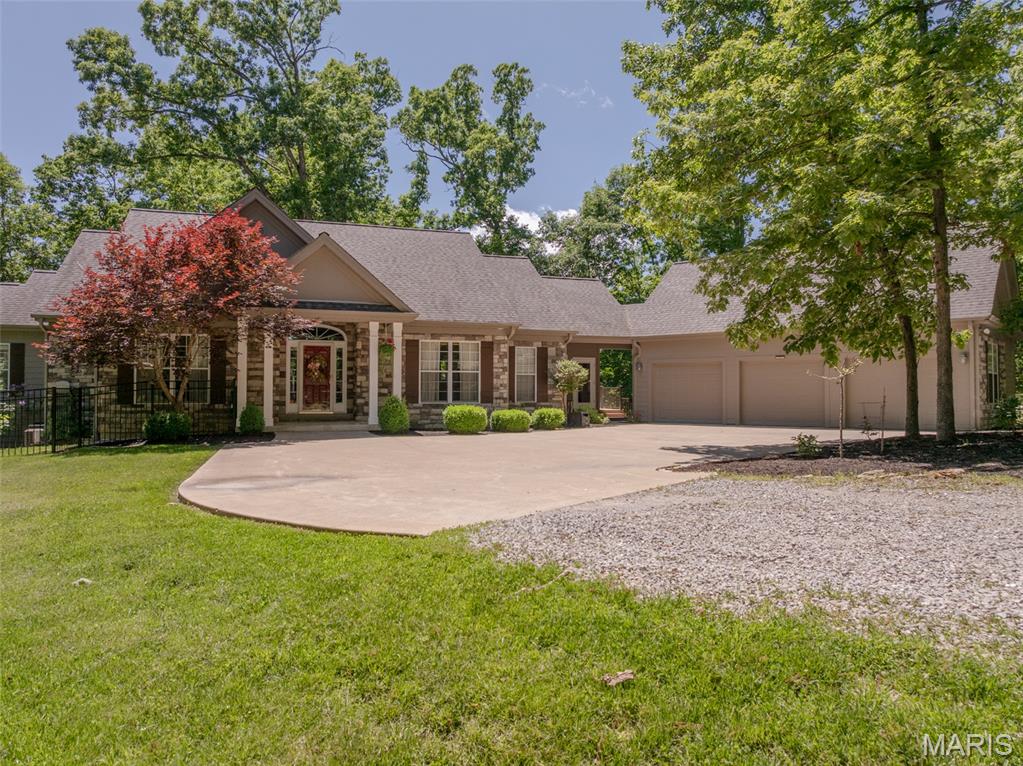 Experience lakeside luxury at its finest in this custom 4BR, 3BA waterfront home on the tranquil shores of Lake Konstanz. Soaring windows flood the open living area with natural light, highlighting elegant finishes and a charming fireplace. The gourmet kitchen boasts a stunning center island with cooktop, premium stainless appliances, and seamlessly flow into a spacious dining area—perfect for entertaining. Unwind in the four-seasons room or step out to the expansive deck with breathtaking views. The main-level primary suite offers a spa-like ensuite with soaking tub, walk-in shower, and double vanities. A finished walk-out lower level features additional bedrooms, a full bath, fireplace, rec/office space, and patio with hot tub. Enjoy a private beach, fenced pet area, and 3-car garage—all on a rare, level lot offering unmatched serenity. Select furnishings included. Don’t miss this rare opportunity for luxury lakefront living at Innsbrook!