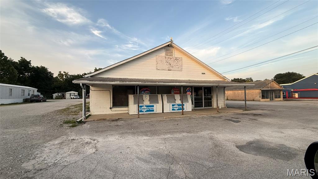 A landmark of the community this grocer has been serving the residents for more than 30 years.  Flat and level lot with large retail building, fronting highway 61 in R7.  Ideal for continuing a liquor/grocery story or other retail business.  Ideal location for a daycare, easy and convenient for customers.  Priced to sell quick.  Building needs some tlc but overall is a great opportunity for anyone looking to start or continue a great business.