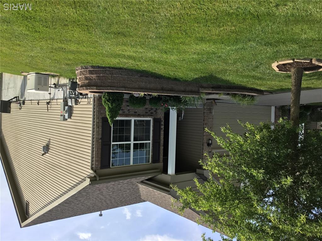 If you are looking for a townhouse with charm, a gas fireplace, many upgrades, end unit privacy looking out over green space, with a deck off the main level and a patio out the lower level, you should hit showing time and make an appointment to show right now. Here is a partial list of upgrades this home has to offer. Cathedrial ceiling in Living Room, Coffered Ceiling in Bed Room. Main Bedroom has a Bay Window. The LL has a additional Bed Room and Private Bath. Sprinkler system, Custom Blinds thoughout. Granite Counter tops, 42' cabinets, Double buit in Wall Oven,