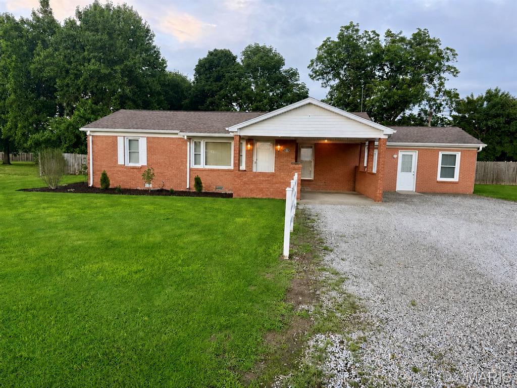 Looking for a cozy, updated home in Holcomb, MO? This one checks all the boxes. In addition to the main home, you’ll enjoy an attached bedroom with its own half bath, perfect for guests, a home office, or multigenerational living. Step inside to find a bright, inviting layout with new flooring (April 2026) throughout the bedrooms, living room, and dining room. The fully updated kitchen features brand new cabinets, countertops, and sink—plus a new dishwasher (2025), refrigerator, and electric stove/oven included. A charming sunroom provides the perfect spot for morning coffee or extra living space, while the fenced in backyard is ideal for pets, play, or outdoor entertaining. The property also includes a covered 1 car carport for convenient parking. New central heat & air installed in October 2023 will give peace of mind (electric A/C through Ameren; gas heat through Liberty Utilities). This home has been well cared for, thoughtfully updated, and is truly move in ready for its next owner. This property presents an opportunity to craft your ideal lifestyle within a well-established setting. This is more than just a house; it's an invitation to envision your future. Inquire today to schedule your private showing and experience the possibilities firsthand.