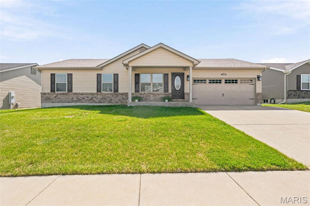 Beautifully updated and well maintained 3 bedroom, 2 full bathroom ranch home in a quiet subdivision in the Wentzville-Holt school district. Step inside to find vaulted ceilings, updated lighting and new flooring throughout the home. The kitchen features stainless steel appliances, refrigerator that is included, granite counter tops, center island and ceramic tile flooring. Each of the three bedrooms have new carpeting, overhead lighting and window treatments, with the primary bedroom featuring vaulted ceilings, walk-in closet and en-suite bath. The spacious main floor laundry room has a great space for a drop zone and features closet with new wiring shelving. The 2 car (21 ft x 18 ft) garage also features an additional 9x6 extension, great for bikes, toys and storage. The unfinished basement features an egress window for future 4th bedroom, a rough-in for full bathroom and 2 additional windows for natural lighting. Additional features included a Lennox Elite HVAC system, covered front porch, new architectural shingle roof in 2024, level backyard w/ patio and an upgraded front door. Make this your new home today!