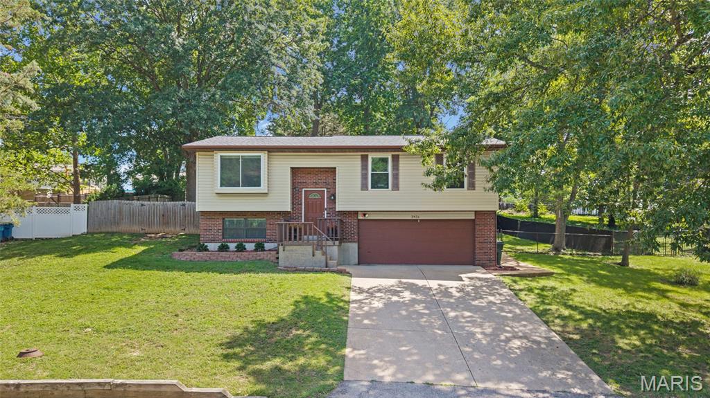 Welcome to this beautifully updated split-level home, where modern finishes meet exceptional outdoor living. Tucked away on a quiet street, this 3-bedroom, 2.5-bath residence offers the perfect blend of comfort, style, and functionality. Step inside to discover a thoughtfully remodeled interior featuring vinyl plank flooring throughout the main living areas, fresh paint, and new carpet for a crisp, move-in-ready feel. The heart of the home is the stunning, renovated kitchen, complete with custom cabinetry, granite countertops, and updated appliances—designed for both everyday living and effortless entertaining. The inviting living room is anchored by a sleek electric fireplace, creating a warm and welcoming atmosphere. The spacious primary suite offers a private retreat with its own en-suite bath, while additional bedrooms provide flexibility for guests, family, or a home office. Step outside and experience your own private backyard oasis. The expansive 39x18 deck is ideal for entertaining, featuring a built-in Aspen hot tub, gazebo, and firepit area—perfect for relaxing evenings or hosting gatherings. The fully fenced yard enhances both privacy and functionality. Major updates provide peace of mind, including a updated windows, and a brand-new roof on the home, gazebo, and shed. Additional improvements such as the removal of popcorn ceilings and modern finishes throughout further elevate this home’s appeal. Conveniently located with easy access to Highways 141 and 55, and just minutes from shopping, dining, and everyday amenities, this property truly offers the best of both comfort and convenience. This is the one you've been waiting for—schedule your private showing today.