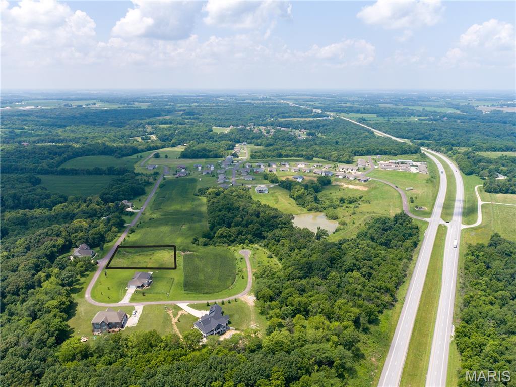 Build your dream home on this one-acre lot in a premier, established & growing subdivision surrounded by beautiful custom estates. Located just outside of town, you’ll enjoy the perfect balance of privacy and convenience with easy highway access—only 10 minutes to downtown and just 5 minutes to schools, shopping, and everyday amenities. Electric is already available at the road, making your building process even more convenient. Whether you’re ready to build now or planning for the future, this is a prime opportunity to secure your spot in a highly desirable area. Don’t miss your chance—call today for more details!