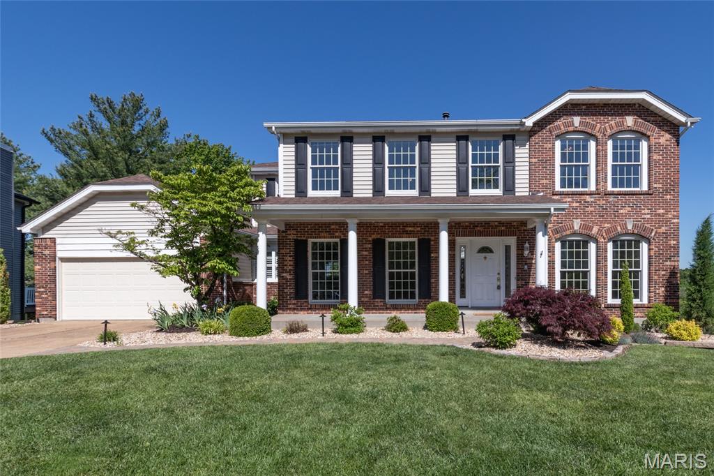 Showing start Thurs., May 14. This wonderful two story, with over 3600 sq ft of living space, has been meticulously maintained. It boasts 5 bedrooms, 3 full and 1 half baths. Located in sought after The Estates of Arrowhead, it has access to community pool and clubhouse just across the street.  Impressive curb appeal with paver walkway, attractive landscaping, exterior lighting, three sides brick and extended porch. Main level boasts 9 foot ceilings. The two-story foyer with built-in bookcases opens to a formal living and dining room. The expansive great room, with large bay window and bar area, features a deep masonry wood burning brick fireplace and a gleaming newly refinished hardwood floor. You will love the gourmet kitchen with its beautiful wood cabinetry, granite counter tops, large center island, serving area, two built-in ovens and an adjoining breakfast area with bayed doors leading to the 15’x24’ refurbished deck (2025). There you can enjoy the west view and beautiful sunsets. Main floor laundry room is off the kitchen. The Upper Level showcases a vaulted primary suite with hardwood floor, walk-in closet, a vaulted luxury bath with double sinks, soaking spa tub, and a separate shower. Four spacious bedrooms and a full hall bath complete this level. Partially finished walkout lower level adds valuable living space with its large family room, rec room with egress window, and full bath. There is plenty of storage space and built-in shelving. Outside you’ll find a large stamped patio under the deck and a great yard that backs to common ground and trees. Two car over-sized garage. Additional updates include: updated kitchen, new roof (2025) and several freshly painted rooms (2026).