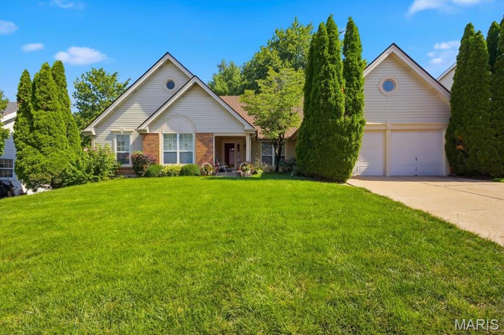 Welcome home to this beautifully maintained & freshly painted 3-bedroom, 3-bath ranch in the desirable Stonegate Estates at Jamestown! From the inviting covered front porch to the peaceful, professionally landscaped backyard, this home offers the perfect blend of comfort, style, and functionality.
Step inside to discover warm wood flooring throughout the main living areas and a spacious, open layout designed for everyday living and entertaining. The expansive kitchen is the heart of the home, featuring a large center island with a hard-surface countertop,  pendant lighting, abundant cabinetry, tile flooring, and a bright eat-in dining area perfect for gathering with family and friends.
The main level also offers the convenience of a laundry room, a welcoming living room, and a comfortable family room with wood burning fireplace. The spacious primary suite serves as a private retreat with a walk-in closet and a well-appointed ensuite bath. Two additional bedrooms, each with plush carpeting, provide ample space for family, guests, or a home office.
The professionally finished lower level adds exceptional living space, ideal for a recreation room, media area, home gym, and additional space for a  hobby room, and includes a walking cedar closet for added storage.
Outside, you’ll enjoy a smartly landscaped backyard designed for privacy, relaxation, complete with a concrete patio and a peaceful setting that’s perfect for morning coffee or evening entertaining.
This move-in-ready home with a total of almost 3000 square feet combines quality finishes, thoughtful updates, and a fantastic location in Stonegate Estates. Don’t miss the opportunity to make this exceptional ranch your next home & add your finishing touches.