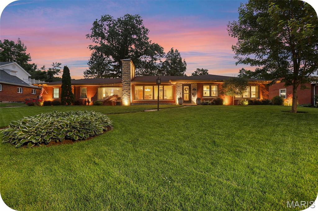 Gorgeous sprawling ranch in the heart of St. Louis Hills Estates—this is the kind of “forever home” buyers wait for! From the moment you walk up the front sidewalk, you can feel how loved and meticulously cared for this home has been over the years. Every space is warm, welcoming & thoughtfully designed for everyday family life and easy entertaining.

The spacious light-filled living room and formal dining room flow beautifully into the kitchen, where gorgeous backyard views make everything from morning coffee to weeknight dinners feel a little more special. Just off the kitchen, the comfortable family room with cozy fireplace is ready for football Sundays, movie marathons, holiday gatherings & everything in between.

The incredible addition creates a true retreat with a luxurious primary suite featuring a spa-like bath and walk-in closet. Two additional bedrooms offer plenty of space for kids, guests or hobbies—plus one even has its own en-suite bath.

Downstairs, the finished lower level gives you all the bonus space every busy family wants: a big rec room for toys, games or sleepovers, a dedicated home office, laundry area & tons of storage.

And then there’s the backyard. You’ll spend countless summer nights on the covered patio with fireplace—perfect for entertaining friends or simply unwinding with the family after a long day. The large, level park-like yard is ideal for kids, pets & backyard soccer games, and the two-car garage adds everyday convenience.

Wonderful house, incredible tight-knit neighborhood & a location that’s hard to beat—prepare to fall in love!