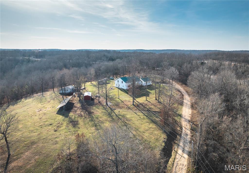 Charming 4-bedroom, 2.5-bath farmhouse nestled on nearly 20 acres, offering the perfect blend of peaceful country living and functional farm potential. This beautiful property is ideal for anyone looking to start or expand a farm or create their own private retreat.

The home features a warm and inviting layout with covered front and rear porches—perfect for enjoying the scenic surroundings and quiet setting. The land is well-suited for livestock or recreation, with multiple outbuildings, a barn, and fenced areas already in place.

Recent updates include a newer roof (2019) and a well pump that’s just one year old, giving added peace of mind. Washer, dryer, and chest freezer will all stay with the home, making this property move-in ready with added value.

Conveniently located just 20 minutes south of Rolla with easy access to US-63, you’ll enjoy the perfect balance of rural privacy and accessibility.