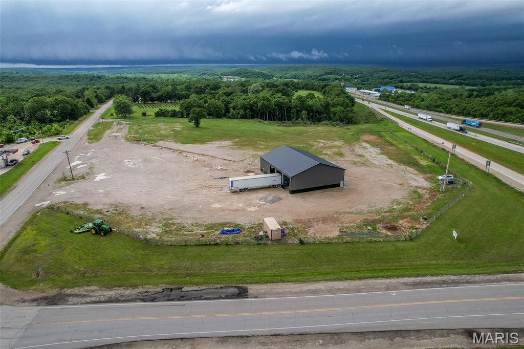 9+ACRES WITH INTERSTATE VISIBILITY PLUS easy access on the Mother Road Route 66 too! The 60X80 metal building was recently added. It has about 17 ft of height access. THE LOCATION IS PERFECT TO BUILD YOUR BUSINESS/BRAND AND IS HIGHLIGHTED BY THE INCREDIBLE TRAFFIC FLOW ALONG THE I-44. Making it ideal for your new business opportunity! Underground electric 400-amp for the building (not connected); gravel and compacted soil for parking; there is a water well on site; The land is partially fenced.