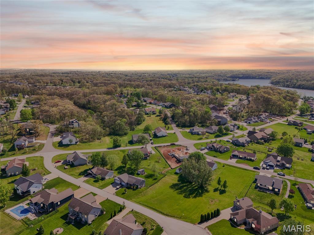 Build your dream home on this beautiful 0.304-acre lot in Foristell, Missouri, perfectly positioned in one of the area’s most unique and amenity-rich communities. This cleared, build-ready lot offers a rare opportunity to start construction right away without the hassle of tree removal or extensive site prep.

Located on the lake side of the neighborhood, this property provides easy, convenient access year-round—no steep hills to navigate, even in winter conditions. Enjoy the peace of mind and practicality of a more accessible location within the subdivision.

The community itself is truly exceptional, featuring multiple lakes ideal for kayaking, fishing, and canoeing, along with a beautiful golf course, clubhouse, tennis courts, sand volleyball, and a private neighborhood pool. Whether you're looking for relaxation or recreation, this neighborhood offers something for everyone.

Don’t miss your chance to own a prime piece of land in a setting that combines natural beauty, convenience, and resort-style amenities.