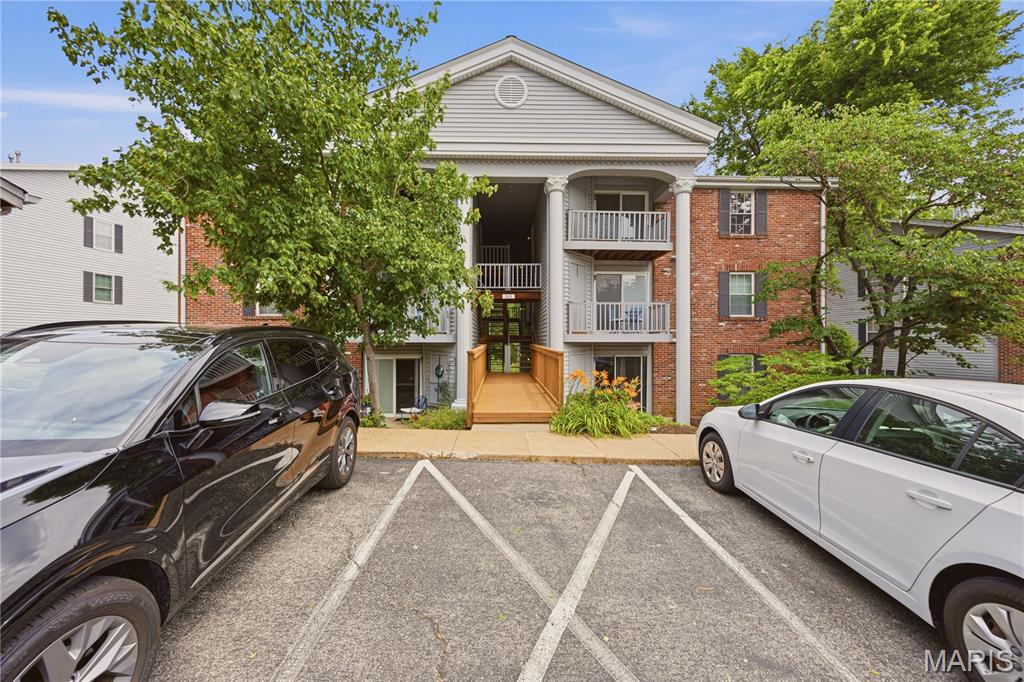Welcome Home to this beautifully updated 2-Bedroom, 2 Full Bath Condo. Wow!!! What a  serene view out the sliding glass doors. Sit and Relax on the deck overlooking Wehner Park. Enjoy easy living in this well-maintained 3rd-floor condo featuring vaulted ceilings that take the home to new heights and luxury vinyl plank flooring throughout. The open and airy layout creates a comfortable space perfect for everyday living. The unit includes in-unit laundry, with a washer and dryer (approximately 1 year old) included in the sale, along with a newer refrigerator. Recent updates add peace of mind, including a replaced furnace and AC unit, new water heater with drain pan, and updated shower enclosure in the primary bathroom. Both bathrooms have been refreshed with updated toilets and vanities. Additional highlights include: One assigned covered carport parking space, a community pool perfect for relaxing during the warm St. Louis summer days, newer flooring throughout the unit with Convenient access to major highways and all that St. Louis county and city have to offer. This move-in ready condo offers a low-maintenance lifestyle in a convenient location—ready for you to call home!