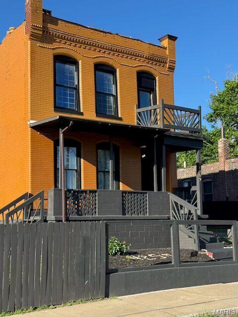 Own a beautifully restored 1904 World’s Fair-era masterpiece blending historic soul with modern luxury.This five-bedroom brick home showcases extraordinary architectural detail, original millwork, and a wrought-iron staircase. The complete renovation features a modern kitchen, new flooring, updated systems, and a newer roof. Large windows flood the interior with natural light, highlighting the preserved early 20th-century charm. The finished basement adds versatile space for a family room, office, or guest suite. Enjoy outdoor living with a level, fenced yard and a private balcony in a rapidly revitalizing historic neighborhood. Vacant lot on each side also included in sale and all parcels are fenced.