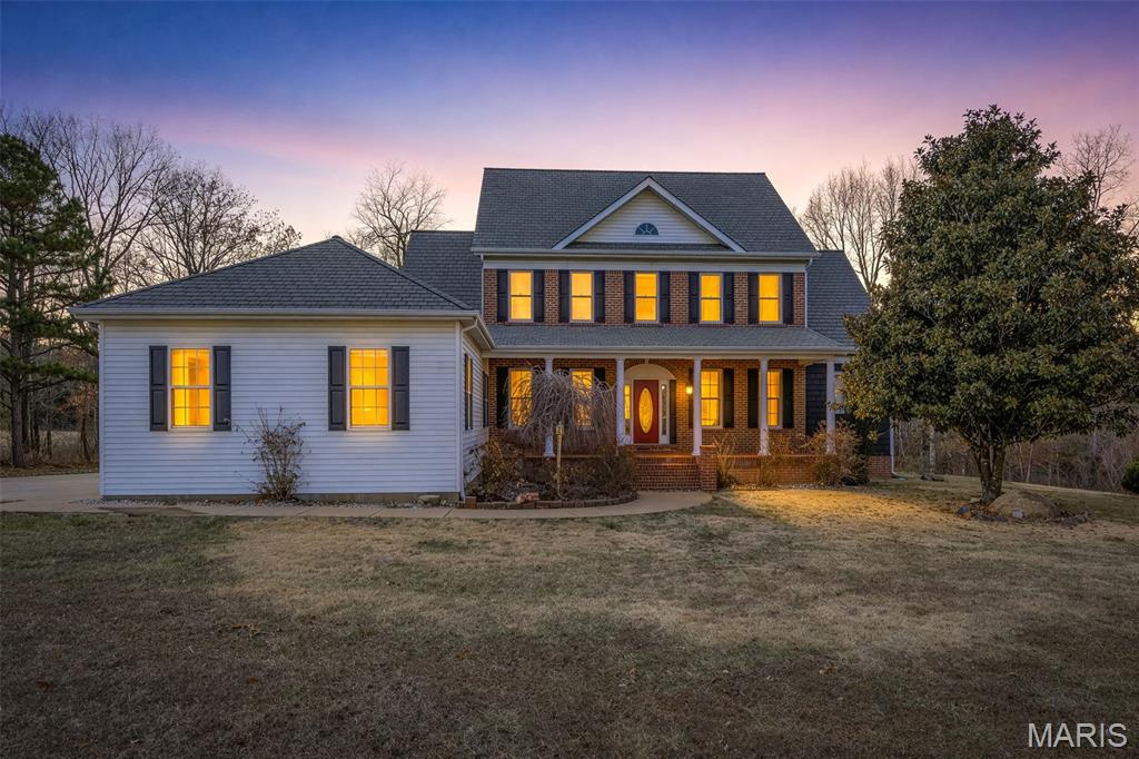 This stunning Colonial-style home is a true gem that’s sure to impress from the moment you arrive. The grand entry foyer sets the tone, leading into a remarkable living room with oak hardwood flooring and a dual-sided fireplace framed by custom built-in bookcases. A two-story stacked bay window fills the space with natural light, creating a bright and welcoming atmosphere. The gourmet kitchen is a showstopper, featuring brand-new black stainless-steel appliances, including a French door refrigerator, microwave/wall oven combination, and electric cooktop with a pop-up vent hood. Custom cabinetry and generous pantry space provide ample storage. From the kitchen, walk out to a 13x18 back deck, perfect for entertaining or relaxing outdoors. On the opposite side, access the 6x11 mud/laundry room, which connects directly to the 24x30 attached garage. The primary suite is truly exceptional, featuring oak hardwood floors, private access to the back deck, and a spa-inspired bathroom complete with a jetted soaking tub beneath an elegant arched window, separate shower, dual vanities, and a spacious 6x12 walk-in closet. Off the foyer, you’ll find a beautiful formal dining room on one side and a cozy sitting room on the other—perfect for entertaining or quiet relaxation. Upstairs boasts four additional bedrooms, an upper-level sitting area (ideal as a playroom or reading nook), and a full bath with a catwalk overlooking the impressive living room below. The lower level offers even more living space, including a 14x23 bedroom/office with walk-out access to a private deck and its own full bath. There’s also a partially finished 12x14 dining area, a 19x21 family/TV room with a pellet fireplace, and approximately 926 sq. ft. of storage space. Enjoy outdoor living on the 8x36 front porch or take a swim in the above-ground pool, complete with a 12x32 deck, perfect for summer gatherings. This immaculate home combines classic architecture with modern updates and premium finishes, offering both comfort and timeless style. A must-see property!