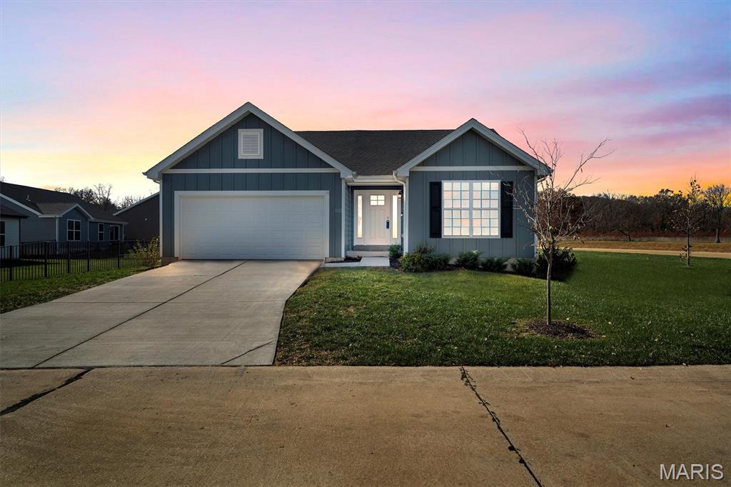 Step into this nearly new 4 bed and 3 bath ranch in Fox Run and enjoy the feeling of a brand new home without the long wait. Only two years old, this property sits in a growing subdivision where new homes are still going up, yet this one is ready now and packed with upgrades. The main level offers an open floor plan with vaulted ceilings that lift the living room and kitchen, creating a bright and spacious setting for daily life and gatherings. Three bedrooms sit on this level, including a primary suite that features a generous walk in closet and a private bathroom with a double vanity.

The finished lower level adds the kind of space that makes a home stand out. A large bedroom with its own walk in closet sits alongside a full bathroom, making it ideal for guests or extended family. There is also a gym or flex space that can shift with your needs, plus a full living room with a wet bar that turns the basement into a true second hangout zone. It is perfect for movie nights, game days, or quiet weekends.

A concrete patio and fenced backyard create an easy outdoor setup that is ready for grilling, pets, or play. The builder warranty transfers with the sale, giving buyers added confidence and reinforcing the almost new feel of this home. The home is set within the scenic Fox Run Golf Club community, giving buyers close access to the course as well as the clubhouse, dining options, and event space. It is an ideal spot for golfers or anyone who enjoys a social and active neighborhood setting.

If you want the feel of new construction without the delay, this home delivers comfort, style, and convenience from day one.
