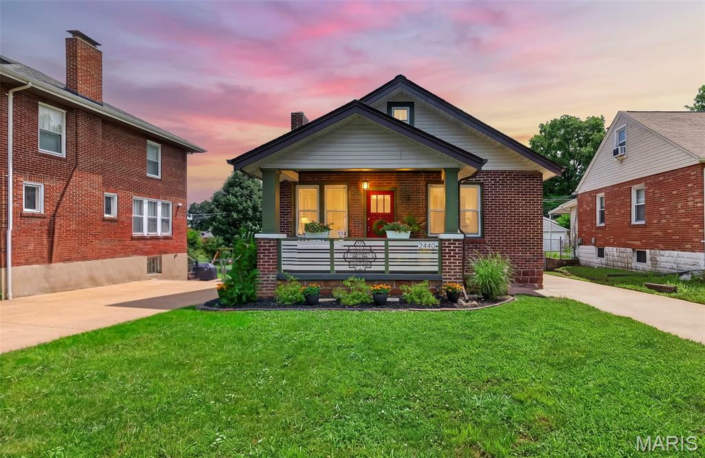 Showings begin at open house Sunday 7/19 from 1pm-3pm.  Fabulous Craftsman style home - renovated to intentionally protect original features of this 100 year old home.  2440 Northland is located on a beautiful, quiet, tree lined street in Sycamore Hills where neighbors are friendly and care for their homes.  Location makes it easy to get anywhere in St. Louis.   The front porch welcomes you and even includes a porch swing to enjoy your morning coffee.   As you enter the home the original wood floors are warm and gleaming and the built in bookshelves are original - even the hardware!  Updated Kitchen include new appliances, and the Bath is updated too..   Large rooms offer plenty of space for family gatherings - two bedrooms (one would make a delightful home office).   New sump pump, AND new concrete pour in tuck under garage.   2 CAR DETACHED GARAGE PLUS A SINGLE BAY TUCK UNDER GARAGE - AND LOTS OF PARKING SPACES!!  This home is special and ready for the next home owner to make it their own.