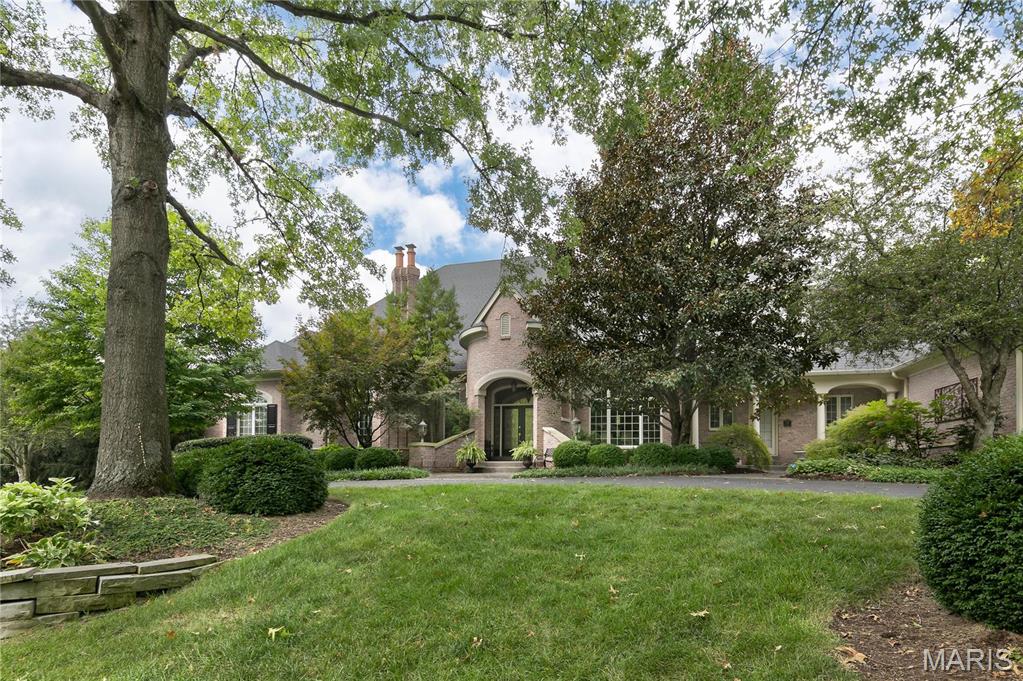 Exceptional quality is found in the construction of this former Deshetler model home. Arched room entrances, arched windows, multiple piece crown moldings & other detailed millwork & soaring ceiling heights.  Upon entry, find a handsome paneled Office/Den w fireplace & gracious Din Rm w double tray ceiling.  Main floor Primary Bedrm w fireplace & luxury bath. In addition, there are 2 other main floor BR.  Every BR has private bath. Wonderful Hearth Rm right off of Kitchen/Breakfast area. Wet Bar leads out to patio/pool. Great Rm. Main Floor Laundry. Second floor has Bedroom Ste with its own living room for a perfect Guest/Live-In space accessed by private stair near carpool entry.  Enormous Finished Walkout LL w another BR, Full Bath, Fam Rm, Rec area with billiard table, Wet Bar, Office/Music rm and Exercise rm. Plenty of basement storage.  Incredible closet space throughout!  Oversize 4 car gar, private pool w waterfall & outdoor grill/kitchen. Dream home in great location.