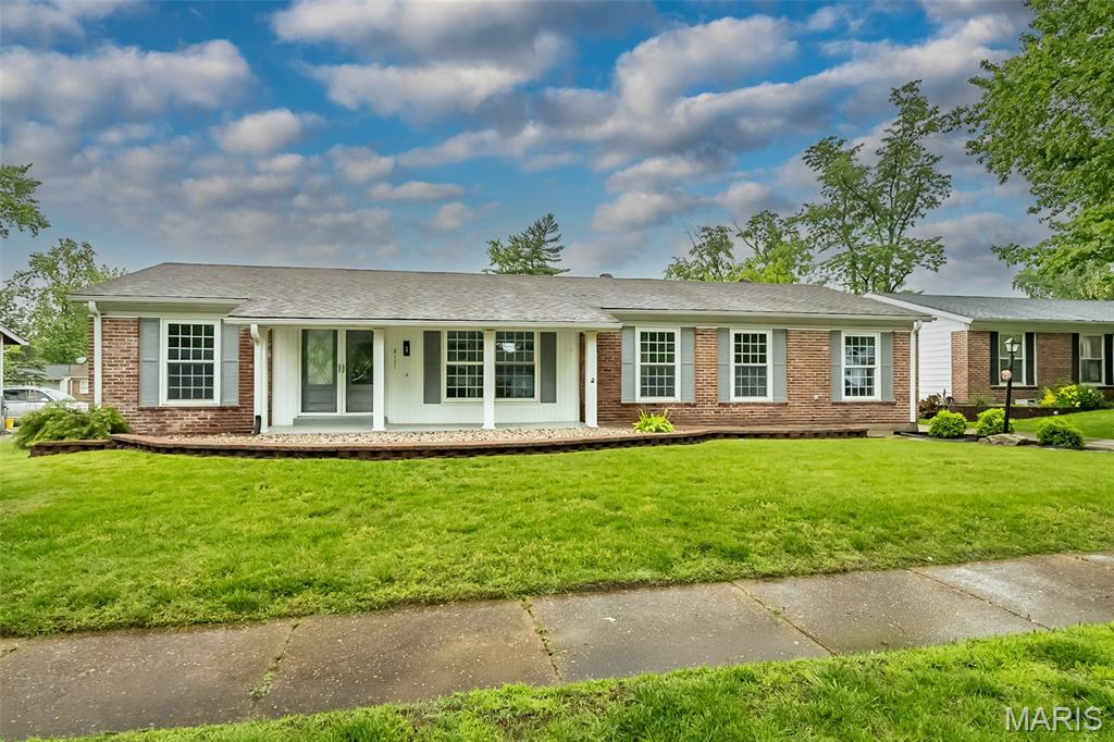 This Luxury renovation in Florissant is sure to impress! The 3 bedroom/2 bath ranch home offers original charm with modern updates. As you enter the home, you'll notice the new luxury vinyl tile floors. The open concept living room, dining room and kitchen are perfect for entertaining. The kitchen features new stainless steel appliances, custom cabinets and quartz countertops. The bathrooms have been completed updated with new vanities, custom tile and new fixtures. Downstairs offers an additional large finished space for entertaining with a bonus room for an office.  The backyard patio is perfect for entertaining! Rear entry oversized garage makes for a fantastic feature of this home.   The exterior of the home has been completely updated with a newer roof and vinyl siding so you should enjoy years of maintenance free living. This desirable location is close te everything. Come look today! Broker/Owner