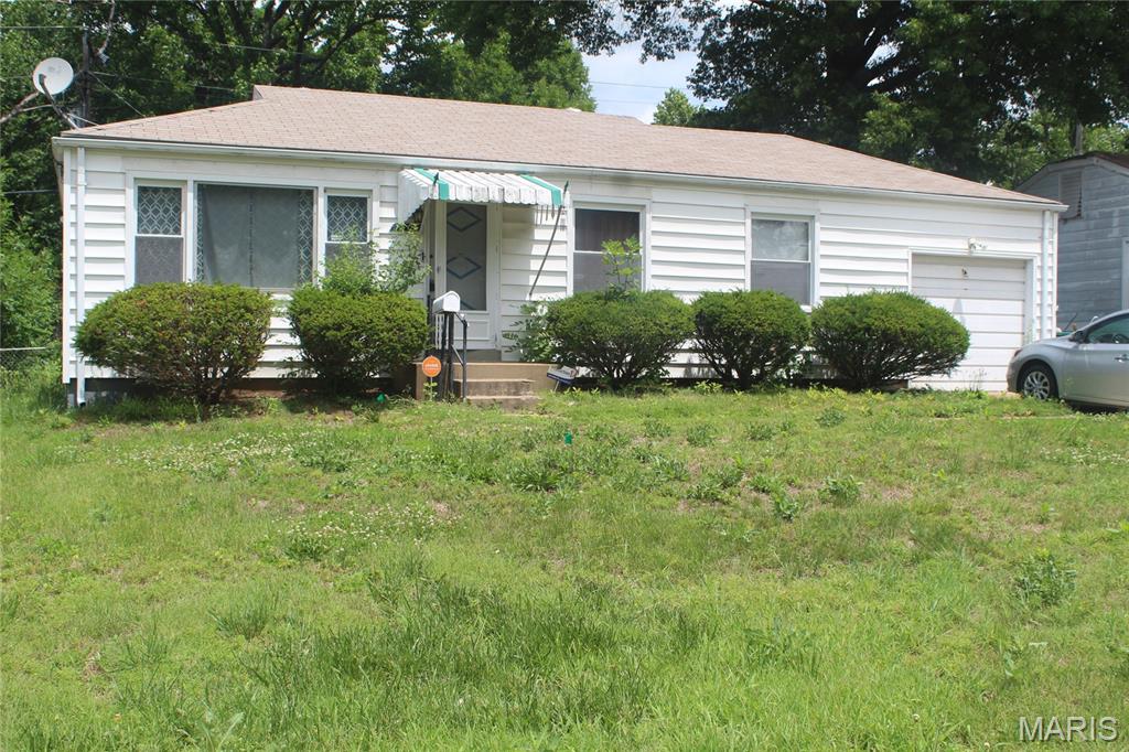 Traditional Bissell Hills, Bellefontaine Neighbors home.  Loved by longtime owner, moving on.  Think of the hardwood floors, a spacious backyard offers room to garden, grill, or just enjoy a quiet evening outside, off the enclosed porch. Property is in need of some updating.