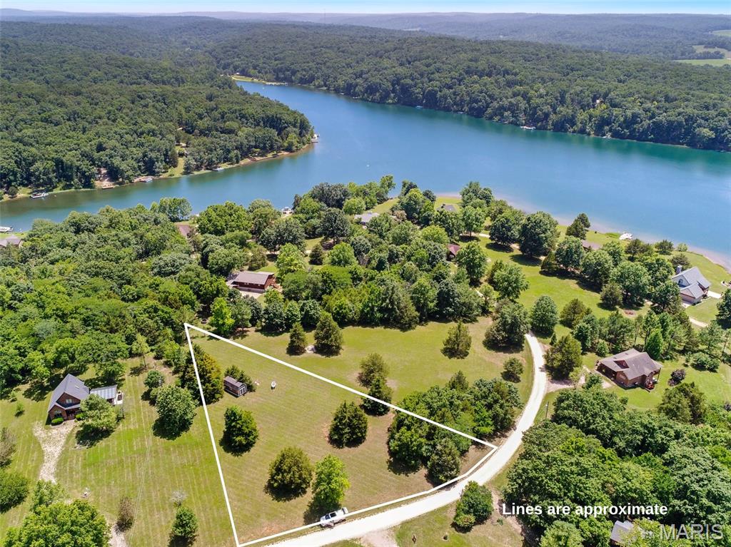 Discover the perfect place to build your dream lake home on this beautiful 1 acre lot in the gated community of Anthonies Mill Resort. Located just over an hour from St. Louis, this private lake community spans approximately 600 scenic acres, offering the ideal blend of recreation, relaxation, and natural scenery. Residents enjoy exclusive access to the private 110 acre Lake Ashley, complete with three boat ramps, sandy beaches, and endless opportunities for boating, fishing, and swimming. The community also features three additional stocked fishing lakes, a swimming pool, tennis and basketball courts, and miles of picturesque surroundings to explore. Lake Ashley is also spring fed, for cool & crystal clear water. 

A spacious storage shed is already in place, providing the perfect spot to store all of your lake day essentials.

Whether you're planning a weekend getaway or a full time residence this exceptional home site offers the perfect setting to enjoy the peaceful lake lifestyle. Don't miss your opportunity to own a piece of one of Missouri's premier private lake communities.