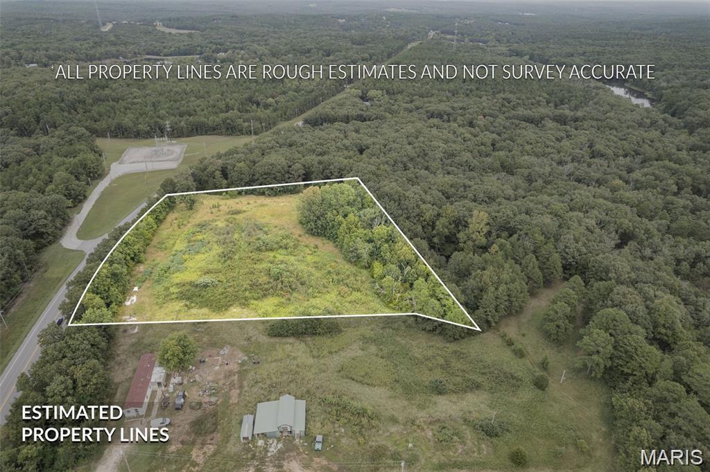 Build your dream home in the Farmington area now.  Located just 6 miles from Farmington on Hwy 32.  Make this choice your best with zero restrictions on 3.05 raw acres.  New survey to be uploaded soon with additional pictures.