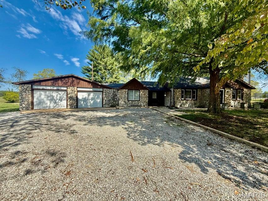 3 Bedroom, 2 Bath Home with Shop on 2 Acres Don't miss this spacious 2,867 sq. ft. home situated on approximately 2 acres just on the edge of the city limits. This property offers a generous lot with mature shade trees while keeping you close to schools, shopping, and all town amenities. Interior features include: 3 bedrooms, 2 bathrooms Massive attached 2-car garage (40' X 36') with plenty of room for parking, storage and/or workshop space Expansive family room with propane fireplace, perfect for entertaining or relaxing evening at home. Oversized laundry room that could serve as a 4th bedroom if desired Beautiful sunroom that opens to a back patio, extending your living space outdoors The property also includes a 30' X 24' shop building with electric and concrete floors, adding even more versatility for projects, storage, or hobbies. With its flexible layout, spacious rooms, and edge-of-town location, this home is a unique find.